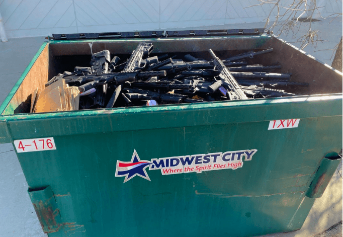 dumpster of guns