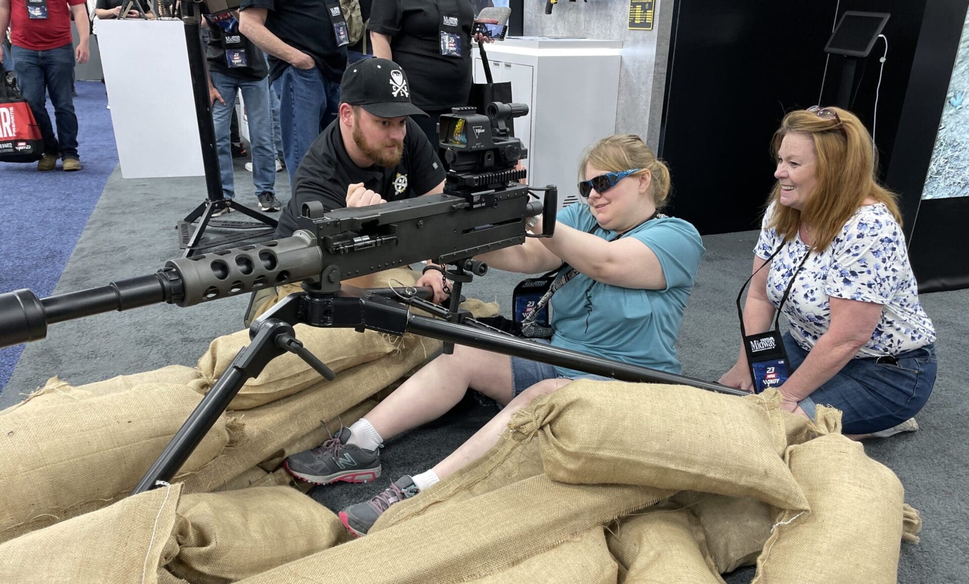 NRA girl convention show machine gun