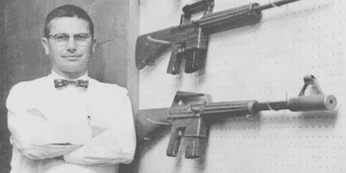 Eugene Stoner displaying his first prototype AR rifles